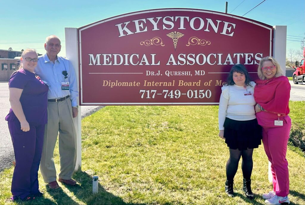 Photo of staff at Keystone Medical Associates standing with sign